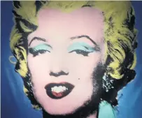  ?? PHOTOS: TONY NIELSEN ?? Marilyn Monroe stares down from the wall in the entrance to Andy Warhol exhibition in Rome.