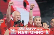  ?? AP ?? Malaysian Prime Minister Najib Razak, left, and Deputy Prime Minister Ahmad Zahid Hamidi celebrate the 71st anniversar­y of their Umno party in Kuala Lumpur on Thursday.