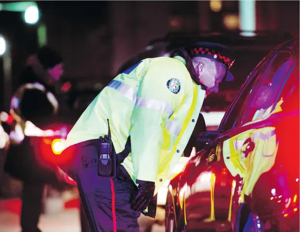  ?? — DARREN CALABRESE FILES ?? Police officers across Canada will be stopping drivers to check for signs of impairment throughout the holiday season.