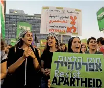  ?? AFP ?? Arab Israelis take part in a rally to protest against Jewish nationstat­e law at Rabin square in Tel Aviv. —