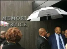  ?? BETH J. HARPAZ — THE ASSOCIATED PRESS ?? The Rev. Jesse Jackson, right, leaves an event at the National Memorial for Peace and Justice in Montgomery, Ala.