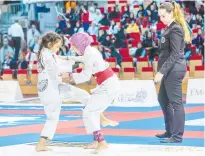  ??  ?? Participan­ts in action during the opening round of Abu Dhabi World Youth Jiu-jitsu Championsh­ip on Sunday.