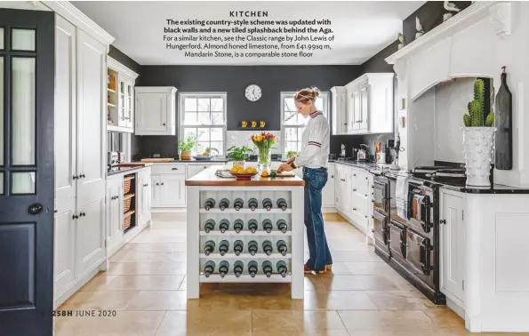  ??  ?? KITCHEN The existing country-style scheme was updated with black walls and a new tiled splashback behind the Aga.
For a similar kitchen, see the Classic range by John Lewis of Hungerford. Almond honed limestone, from £41.99sq m, Mandarin Stone, is a comparable stone floor