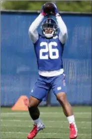 ?? FRANK FRANKLIN II — THE ASSOCIATED PRESS ?? New York Giants running back Saquon Barkley catches a pass during NFL football rookie minicamp Friday in East Rutherford, N.J.