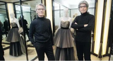  ?? JOHN KENNEY/ THE GAZETTE ?? Réal Bastien, left, and Serge Senécal of Serge & Réal Couture show a dress they designed in 1997. They have been couturiers to generation­s of Montreal society and are soon to retire after launching their business in 1962. For archive shots of their...