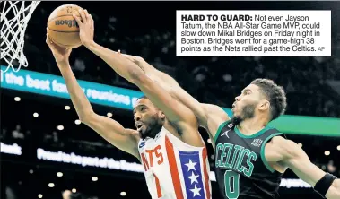  ?? AP ?? HARD TO GUARD: Not even Jayson Tatum, the NBA All-Star Game MVP, could slow down Mikal Bridges on Friday night in Boston. Bridges went for a game-high 38 points as the Nets rallied past the Celtics.