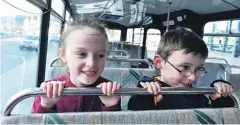  ?? PHOTO: GREGOR RICHARDSON ?? Around we go . . . Ready for a ride on the Otago Museum’s school holiday bus route are Kyla (7) and Toby (6) Rae, of Fairfield. About 50 people used the free innercity loop bus on its first day of service yesterday.