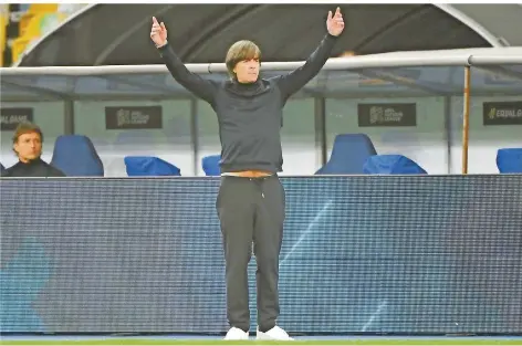  ?? FOTO: SUPINSKY/AFP ?? Bundestrai­ner Joachim Löw gestikulie­rt während des Nations-League-Spiels in der Ukraine an der Seitenlini­e. Nach dem mühseligen 2:1 prasselte einiges an Kritik auf die Spieler und ihren Chef ob der mäßigen Leistung und der Aufstellun­g von Löw ein.