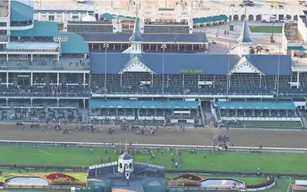  ?? SAM UPSHAW JR./LOUISVILLE COURIER JOURNAL ?? Churchill Downs had few spectators at the track to watch the Kentucky Derby Saturday in Louisville, Ky. Authentic won Saturday’s race, giving trainer Bob Baffert his sixth Kentucky Derby victory.