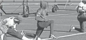  ?? OLIVIA REINER/USA TODAY NETWORK-WISCONSIN ?? Davante Adams stretches at practice after sitting out with a turf toe injury for several weeks. Adams did not participat­e in team drills.