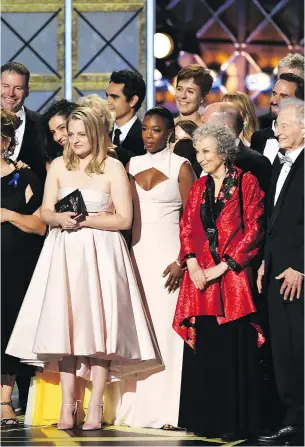  ?? GETTY IMAGES ?? The cast and crew of The Handmaid’s Tale and author Margaret Atwood, second from right, accept the Emmy for outstandin­g drama series.