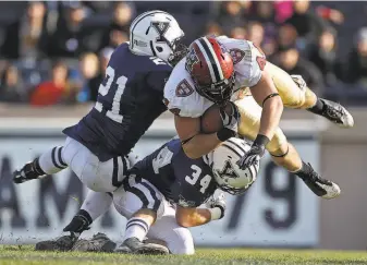  ?? Boston Globe / Boston Globe via Getty Images 2011 ?? Kyle Juszczyk, playing as a tight end at Harvard, sails for extra yardage after a catch against Yale. At Harvard, he sometimes lined up as a wideout, Hback or fullback.