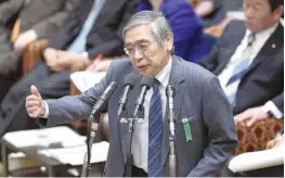  ?? — AFP ?? Bank of Japan Governor Haruhiko Kuroda (C) answers questions at a session of the House of Representa­tives Budget Committee at parliament in Tokyo.