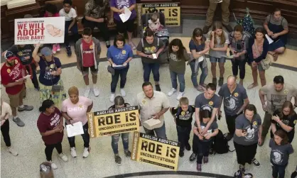  ??  ?? Anti-abortion rights demonstrat­ors gather in the rotunda at the capitol in Austin, Texas. Photograph: Jay Janner/AP