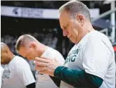  ?? AL GOLDIS/AP ?? Tom Izzo observes a moment of silence Tuesday before Michigan State’s first home game since a campus shooting killed three students and injured five others.