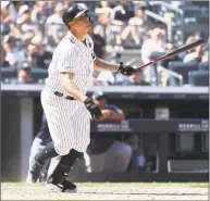  ?? Al Bello / Getty Images ?? Gary Sanchez of the Yankees hits an eighth-inning home run against the Padres during Monday’s game in New York.