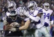  ?? MATT ROURKE - THE ASSOCIATED PRESS ?? Philadelph­ia Eagles wide receiver Nelson Agholor, bottom left, is tackled by Dallas Cowboys middle linebacker Jaylon Smith, top left, outside linebacker Leighton Vander Esch, center, and free safety Xavier Woods during the second half of an NFL football game, Sunday, Nov. 11, 2018, in Philadelph­ia.