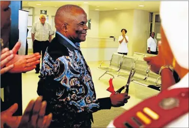  ?? PHOTOGRAPH: JUDY DE VEGA ?? PROUD ACHIEVEMEN­T: Health MEC Sicelo Gqobana cuts the ribbon at the opening of the new oncology department at the Livingston­e Hospital in Port Elizabeth yesterday