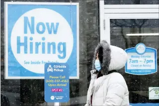  ?? NAM Y. HUH — THE ASSOCIATED PRESS FILE ?? In a stark sign of the economic inequality that has marked the pandemic recession and recovery, Americans as a whole are now earning the same amount of wages and salaries that they did before the pandemic struck, even with nearly 9million fewer people at work.