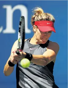  ?? CLIVE BRUNSKILL/ GETTY IMAGES ?? Eugenie Bouchard returns a shot to Evgeniya Rodina during her 7-6 (2), 6-1 loss to the Russian on Wednesday, at the U.S. Open, in New York.