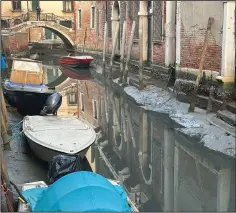  ?? ?? Boats are docked Monday on a dry canal.