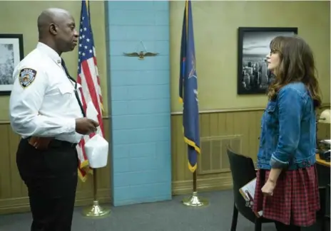  ?? ADAM TAYLOR/FOX ?? New Girl star Zooey Deschanel appeared with Brooklyn Nine-Nine star Andre Braugher on a special crossover episode of New Girl.