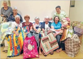  ??  ?? Matamata Patchworke­rs and Quilters gathered last week to attach cards to donated quilts bound for cyclone-ravished Vanuatu in time for winter. From left, Winn Bethune, Janet Madill, Dorothy Grubb, Bridget Gill, Mary Smart, Elaine Reeve, Cindy Dawson...