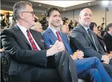  ?? DARRYL DYCK/THE CANADIAN PRESS ?? LNG Canada CEO Andy Calitz, left, Prime Minister Justin Trudeau and B.C. Premier John Horgan were in Vancouver at the announceme­nt of the LNG megaprojec­t in Kitimat.