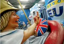  ?? PHOTO: REUTERS ?? A papier mache caricature depicting Britain’s Prime Minister Theresa May for a carnival parade.