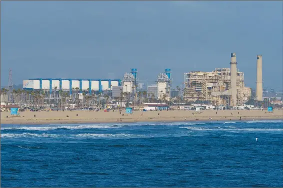  ?? (AP/Damian Dovarganes) ?? The AES Huntington Beach Energy Center is seen May 2 in Huntington Beach, Calif. The AES facility was the proposed site of the Poseidon Huntington Beach Seawater Desalinati­on Plant, the permit for which was denied Thursday by the California Coastal Commission.