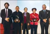  ?? PHOTOS PROVIDED TO CHINA DAILY ?? From left: Loro Piana’s CEO Fabio d’ Angelanton­io, breeders Zhan Fayu and his wife Li Juying, herder Wang Cunxiang and Loro Piana’s deputy chairman Pier Luigi Loro Piana at the award ceremony in Beijing.