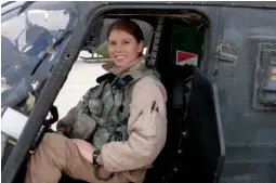  ?? Image courtesy of U.S. Air Forces Central Command ?? Amber when she was Army Chief Warrant Officer piloting the OH-58 Kiowa Warrior during her deployment to Iraq in 2006