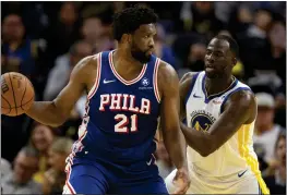  ?? D. ROSS CAMERON — THE ASSOCIATED PRESS ?? Philadelph­ia 76ers center Joel Embiid (21) looks to pass around Golden State Warriors forward Draymond Green (23) during the second half Tuesday, Jan. 30, in San Francisco.
