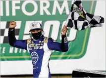  ?? GERRY BROOME / ASSOCIATED PRESS ?? Chase Elliott celebrates after his NASCAR Cup Series win May 28 at Charlotte Motor Speedway in Concord, N.C., where he also won the Truck Series race that week.