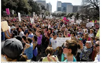  ?? DEBORAH CANNON / AMERICAN-STATESMAN ?? A crowd listens to speakers at the Capitol during last year’s Women’s March events. The gathering was the largest demonstrat­ion in Austin’s history.