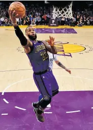  ??  ?? HARRY HOW/GETTY IMAGES Lakers’ Lebron James goes up for the basket against Mavericks during an NBA game at Staples Center, Los Angeles, CA, the US, on November 30, 2018.