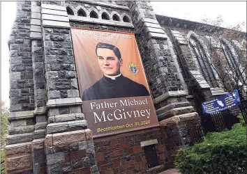  ?? Arnold Gold / Hearst Connecticu­t Media ?? A banner announcing the beatificat­ion of Knights of Columbus founder the Rev. Michael McGivney is displayed outside of St. Mary‘s Church in New Haven on Thursday.