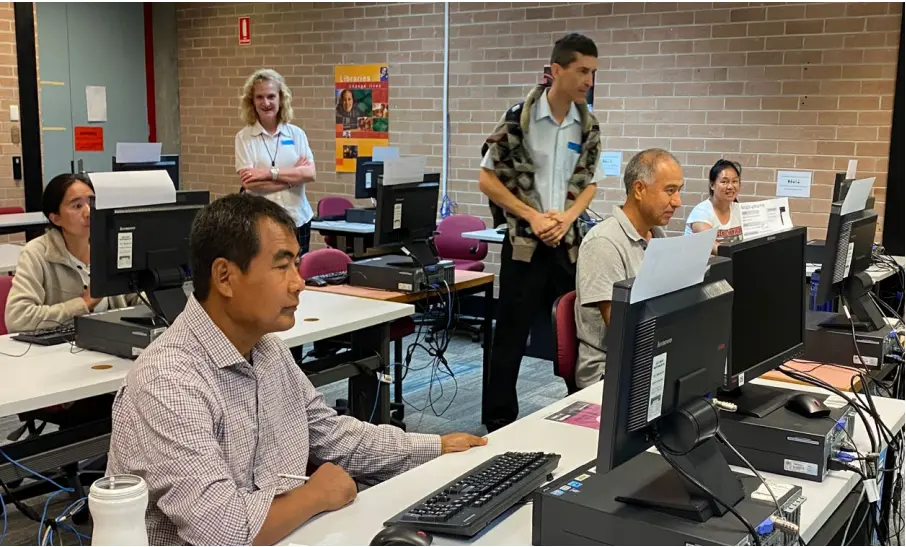  ??  ?? ESOL students engaged in class activities. First row left to right: Pleh Reh, Abdul Rahim Shahbuddin, Robert Ivancic, A Ling. Second row left to right: Mi Meh, Angela Conte.