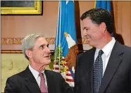  ?? SUSAN WALSH/AP FILE PHOTO ?? in this Sept. 4, 2013, file photo, then-incoming FBI Director James Comey, right, talks with outgoing FBI Director Robert Mueller before Comey was officially sworn in at the Justice Department in Washington.