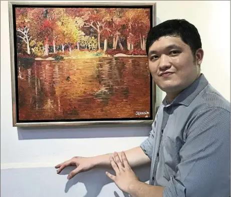  ?? — EVELYN LEN/The Star ?? One of Liew’s favourite artworks is Autumn At The Red Lake, which was on display at his recent solo art exhibition at The Ledge art gallery in Petaling Jaya, Selangor.