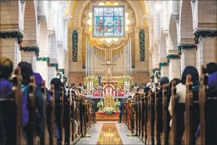  ?? CHRISTMAS EVE Musa Al Shaer AFP/Getty Images ?? Mass at the Church of the Nativity in the biblical West Bank city of Bethlehem in 2019.