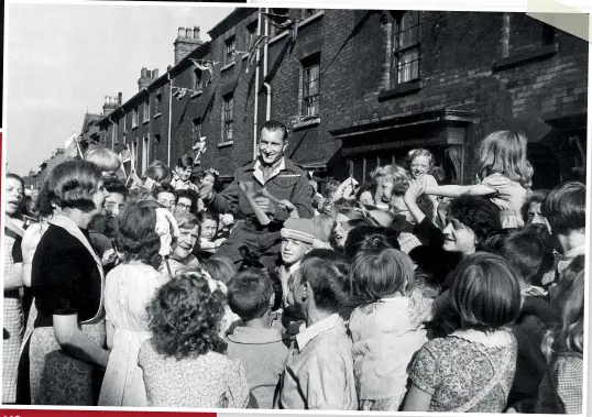  ??  ?? BELOW Private Jim Kavangh of Edward Street in Birmingham could not get home for VJ Day so the children waited until he did return before having their peace day celebratio­n. August 28, 1945