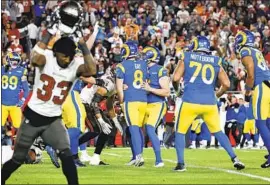  ?? Gina Ferazzi Los Angeles Times ?? JORDAN WHITEHEAD of the Buccaneers tosses his helmet in frustratio­n after Matt Gay kicks a winning field goal for the Rams and is mobbed by teammates.