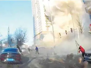  ?? REUTERSPIC ?? A dashcam view shows people fleeing following the explosion in Sanhe. –