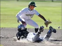  ??  ?? St. Patrick-St. Vincent’s shortstop Wyatt Smith receives the relay throw Monday from center fielder, Stefan Foley to tag out American Canyon’s Antonnio Lawson as he tried to stretch a single into a double during the fifth inning.