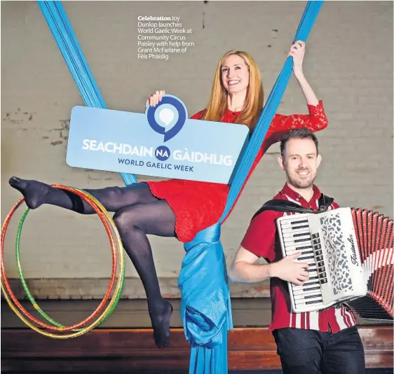  ?? ?? Celebratio­nJoy Dunlop launches World Gaelic Week at Community Circus Paisley with help from Grant McFarlane of Fèis Phàislig