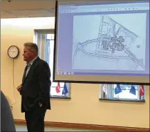  ?? LAWRENCE BUDD / STAFF ?? Architect Gary McAnally fields questions from Warren County commission­ers about the $57.6 million jail he is designing between the current jail and an elementary in Lebanon.