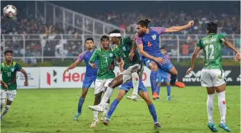  ?? — PTI ?? Indian defender Adil (second from right) scores a goal during their FIFA 2020 World Cup Qualifier match against Bangladesh at Salt Lake Stadium in Kolkata on Tuesday. The match ended 1-1.