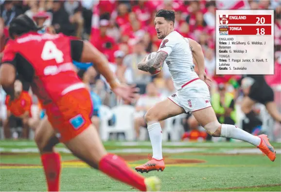  ?? Picture: AFP PHOTO/MICHAEL BRADLEY ?? England’s Gareth Widdop makes a break during last night’s Rugby League World Cup semi-final match against Tonga in Auckland