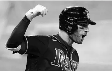  ?? ERIC GAY/AP ?? The Rays’ Kevin Kiermaier, seen celebratin­g a home run against the Dodgers in Game 4 of the 2020 World Series, is happy he’s still with the team in 2021.